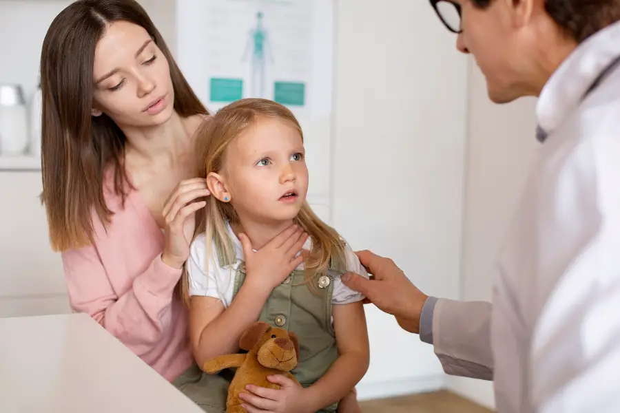Young mother with her daughter at the pediatrician for a consultation